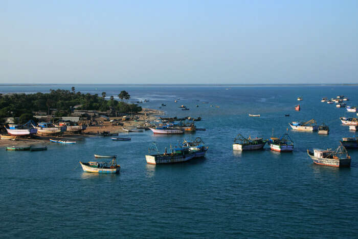 Fishing boats in the sea at a fishing harbor in Rameshwaram