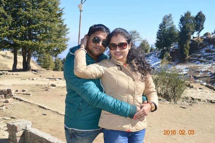 Madhumita and her husband pose for a photo