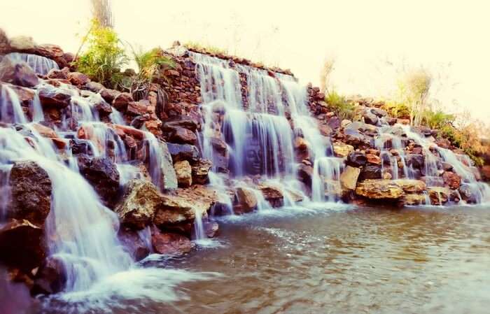 An artificial waterfall at the Water House Resort