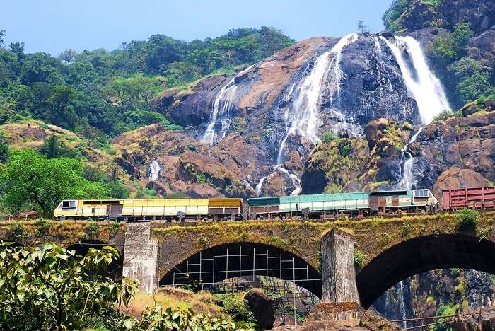 The train passing past Dudhsagar waterfalls in Goa