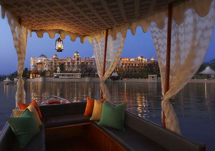 A view of the Leela Palace from a boat in Lake Pichhola
