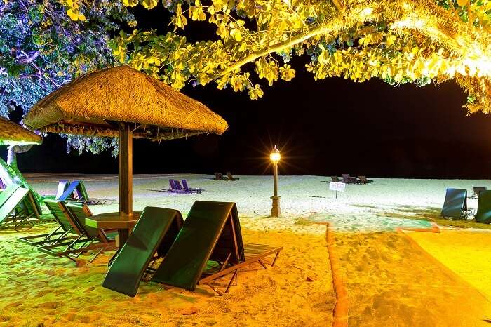 The seating arrangement at the well-lit Pantai Tengah beach at night