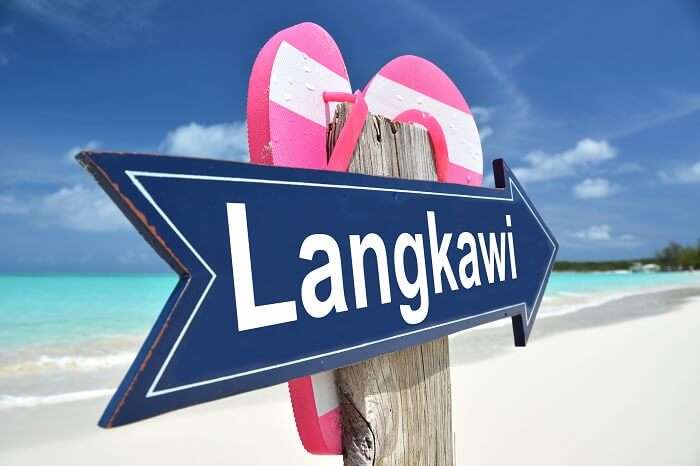 A signboard that reads Langkawi on one of the tropical beaches of the archipelago