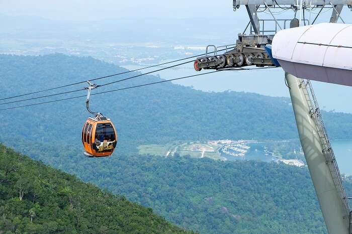 The high cable car with the hills and the sea visible in the background and wonderful places to visit in langkawi