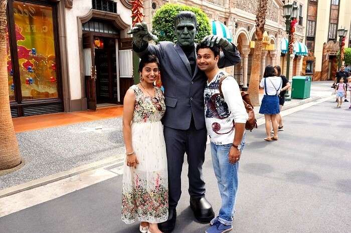 Bhargav and his wife pose in Universal Studio Singapore