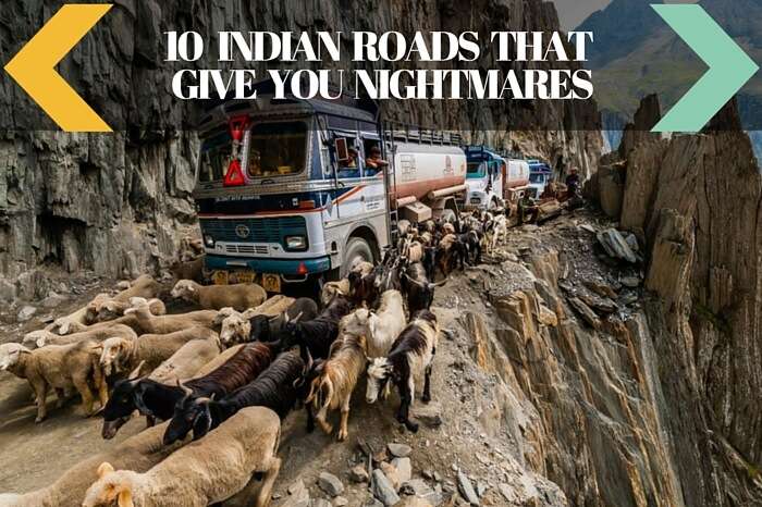 A group of trucks and a flock of sheep try to pass the narrow road near Zoji La Pass