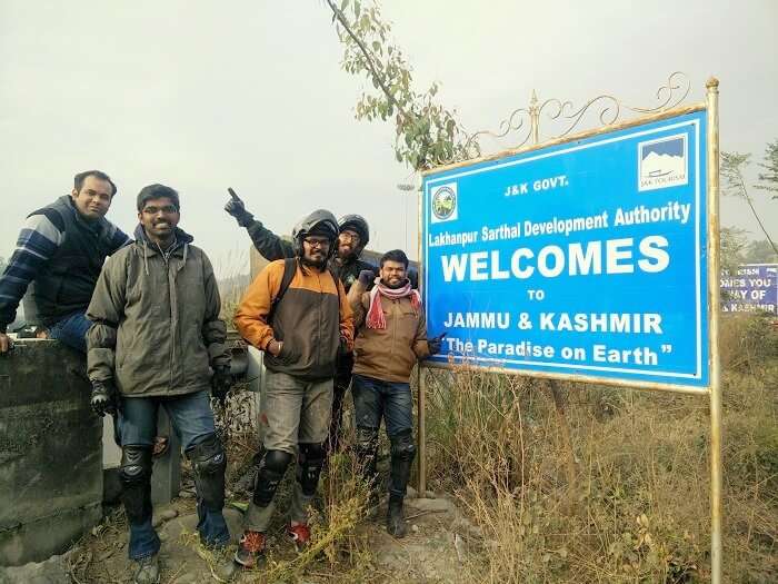 Sundar and his friends pose with Welcome to Kashmir board