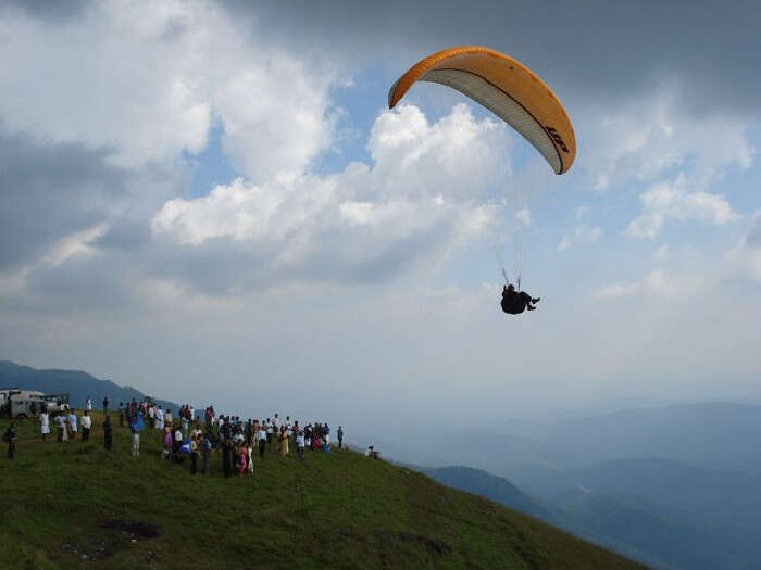 A person paragliding at the beautiful Kamshet hill