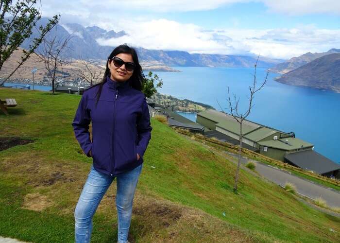 Anikta in the background of scenery in Queenstown