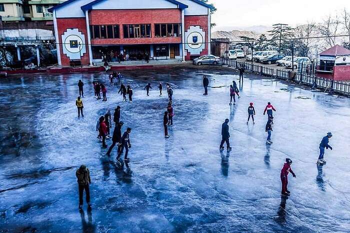 Tourists and locals try ice skating - one of the popular things to do in Shimla in winters