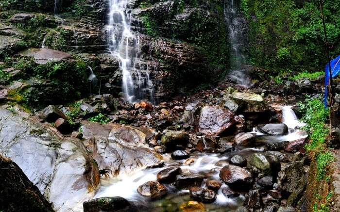Enliven your soul splashing around the beautiful Kanchenjunga Falls