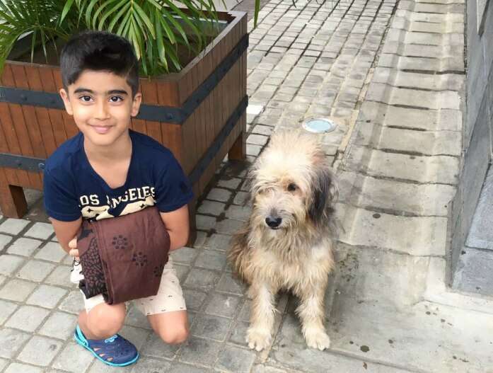 Raj Kumar and his son with a puppy in Port Louis