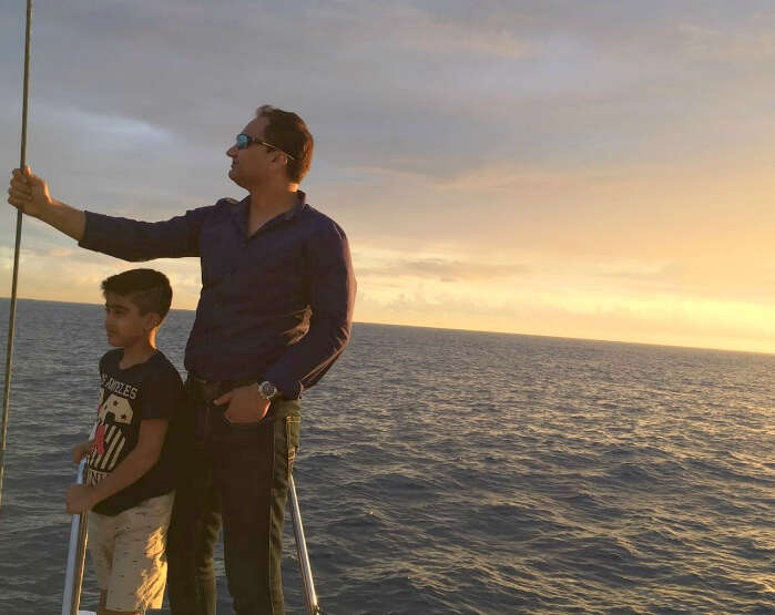 Raj Kumar and his son on the boat for submarine ride