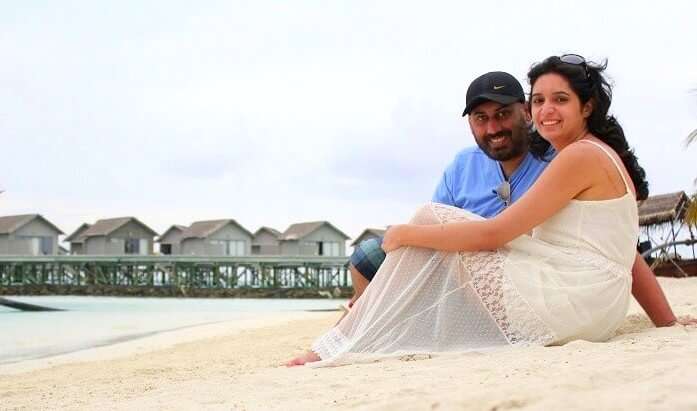 Angad and his wife on a beach in Maldives