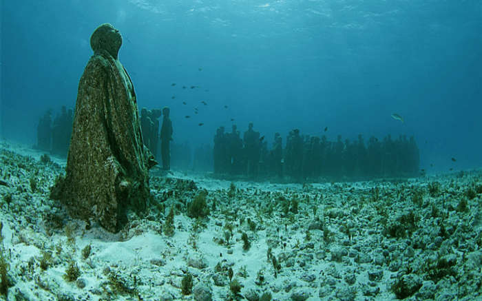 Statues of people whose remains were used to create the Neptune Memorial Reef.
