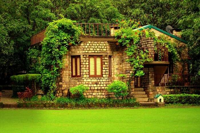 A lovely cottage facing a lush garden at The Den Corbett