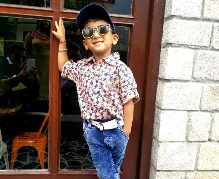 Sachins son poses outside their hotel in Manali