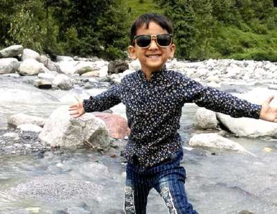 Sachins son having fun in the river in Himachal