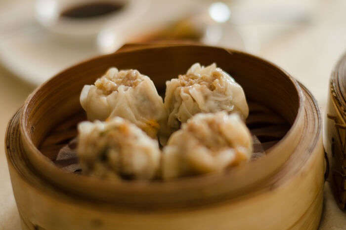A pot full of dimsums being served in a Mauritius diner