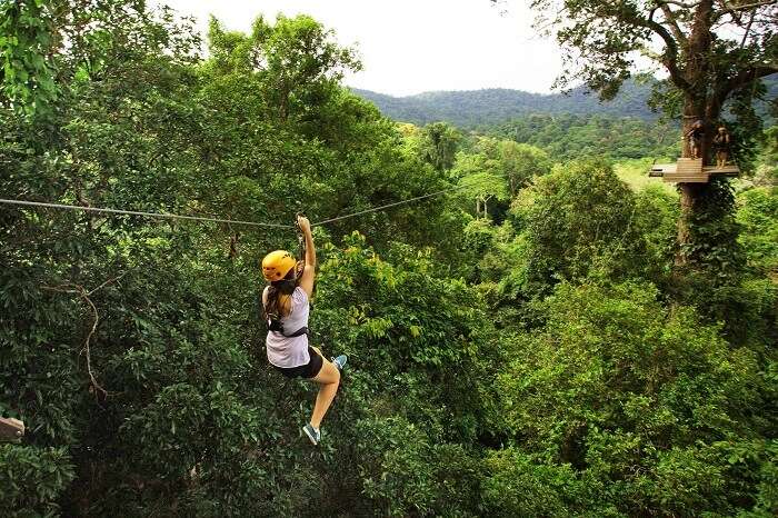 A tourist tries ziplining that is one of the best things to do in Pattaya