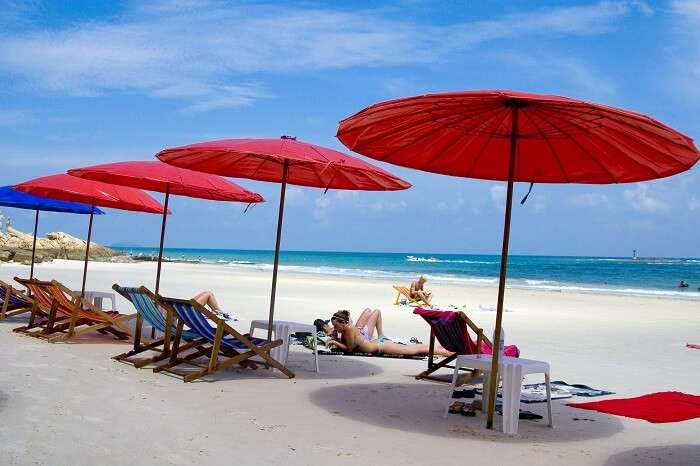 Tourists relax on a beach in Koh Samet