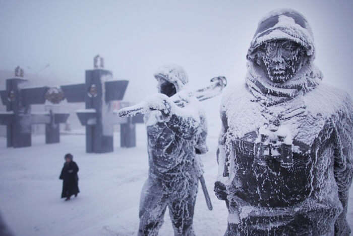 Snow-covered statues on the streets of Oymyakon in winters