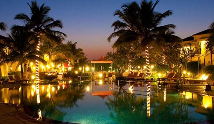 A late evening snap of the well-lit swimming pool area at the Royal Orchid Beach Resort and Spa