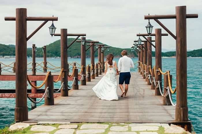 Honeymoon couple relax on beach in Vietnam