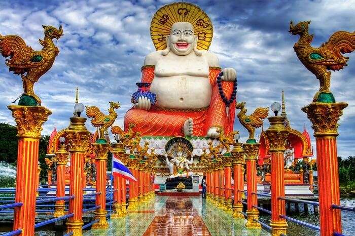 The Smiling Buddha statue at Wat Plai that is one of the popular tourist attractions in Koh Samui