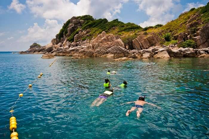 Tourists try snorkeling that is one of the best things to do in Koh Samui
