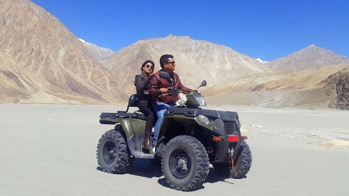 Vishal and his wife on a quad bike in Ladakh