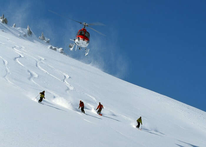 Experience the thrill of Heli Skiing in Manali, one of the best things to do in Manali during snowfall