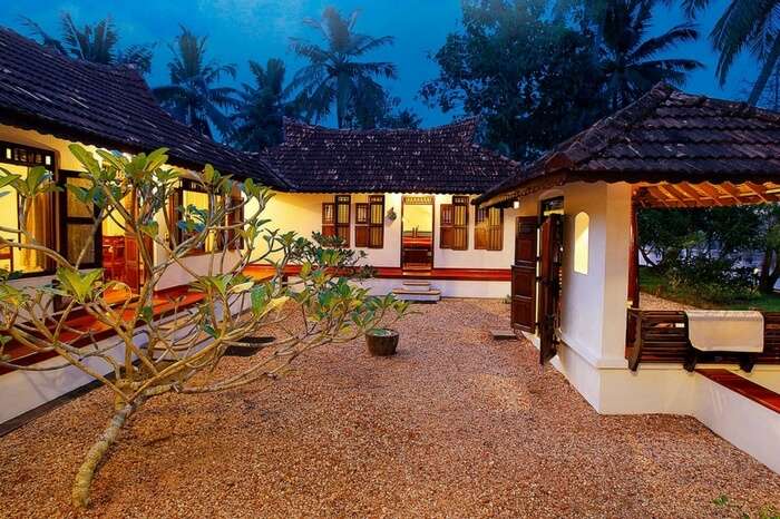 Well-lit villas of Philipkutty Farm in Kumarakom region in Kerala