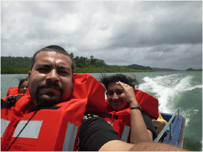 Aashish and his wife in a boat in Andaman