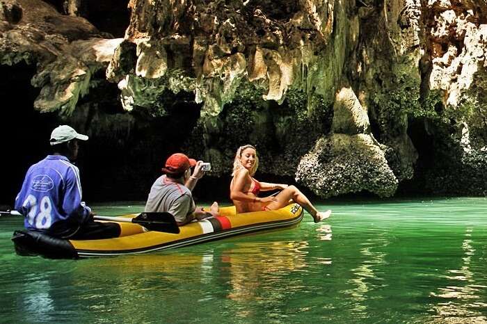 A couple on a canoeing trip in Phang Nga Bay in Phuket