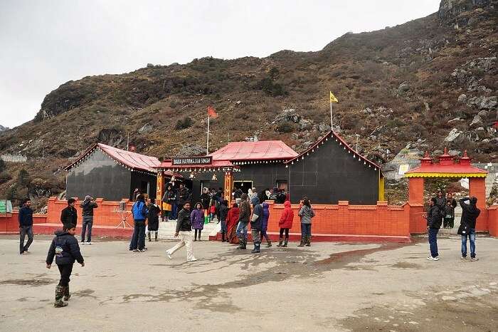 Tourists pay a visit to the Baba Harbajan Singh Mandir at the Nathula Pass