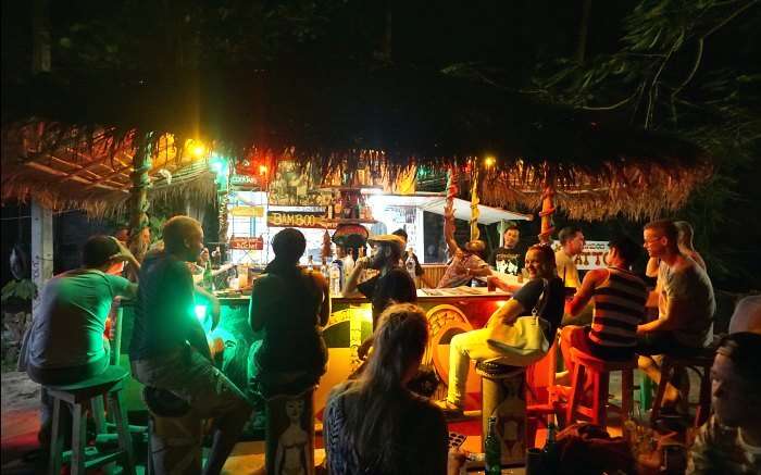 People enjoy live music and drinks at a party in Bamboo Bar