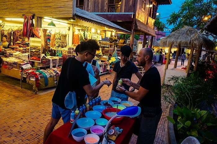 Tourists bargaining at a shop of the famous Cambodian Angkor night market