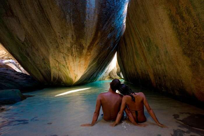 Couple at the baths of Virgin Gorda on the British Virgin Islands in Caribbean