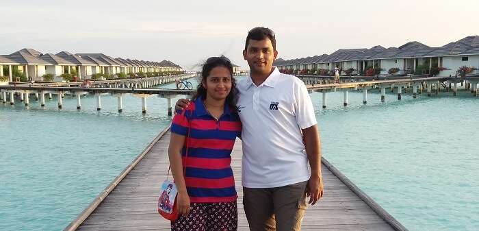 Karthik and his wife enjoy looking at the crystal clear waters of Maldives
