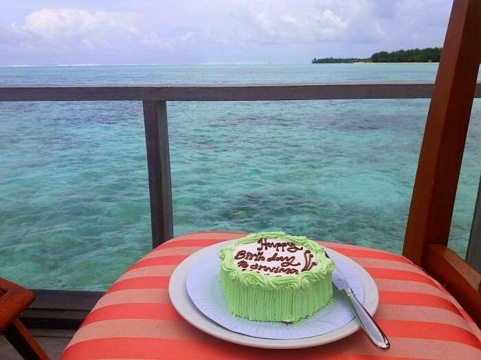 Cake cutting ceremony in water villa in Maldives