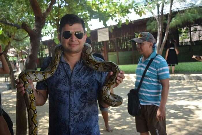 Mitaksh holding a python