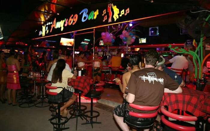 Tourists enjoying drinks and food at the famous Amy’s Bar in Soi RCA Ao Nang