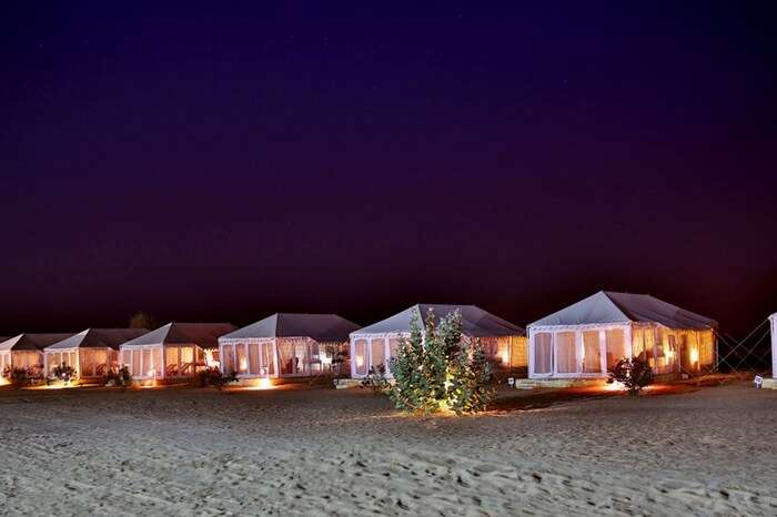 Well-lit tents of Winds Desert Camps