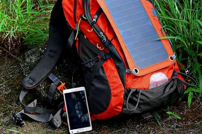 Gopax solar backpack charging a smartphone