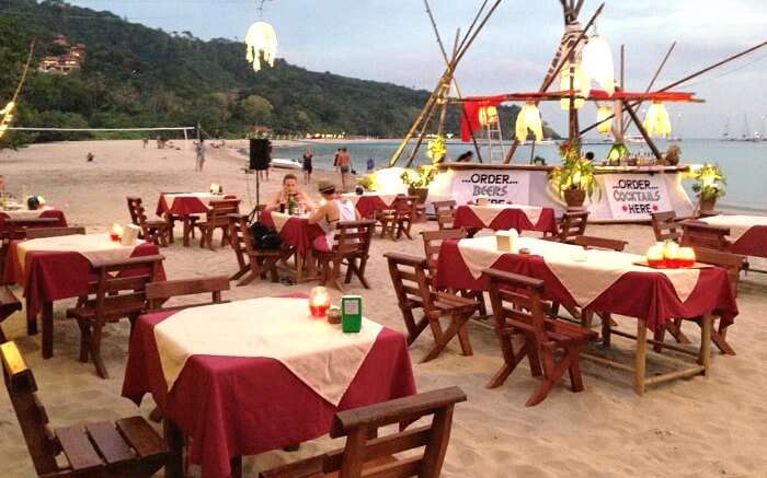 Tourists enjoying the evening at Why Not Beach Bar in Koh Lanta