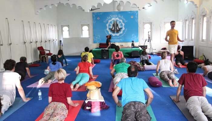 Participants practice yoga during the International Yoga and Music Festival in Rishikesh