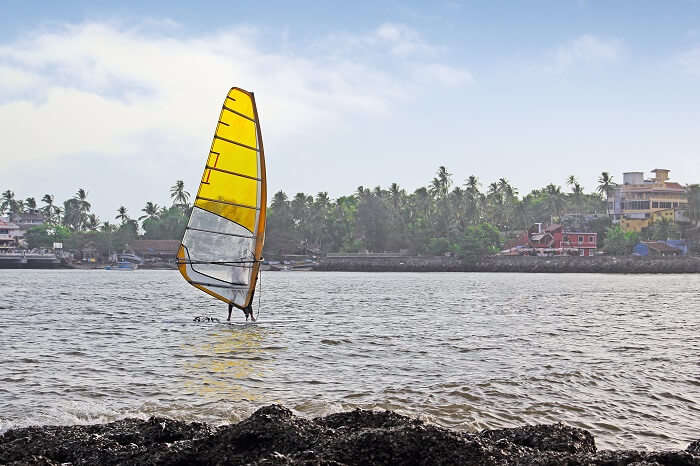 A tourist indulges in kitesurfing at the Dona Paula Bay in Goa