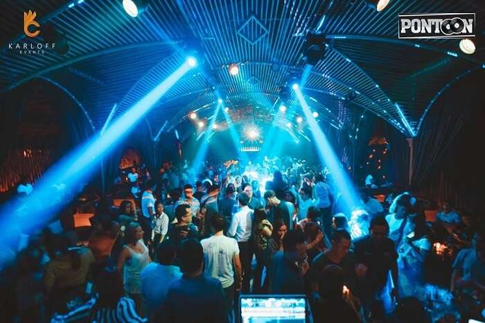 Guests dancing under the disco lights at Pontoon - one of the best places to enjoy nightlife in Cambodia