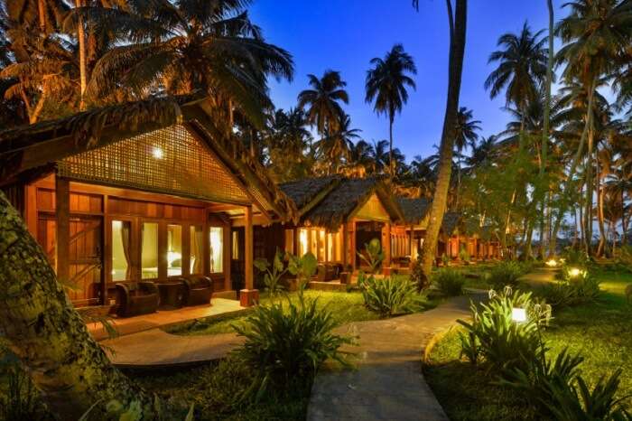 An evening shot of the well-lit cottages at the Sea Shell Resort in Havelock